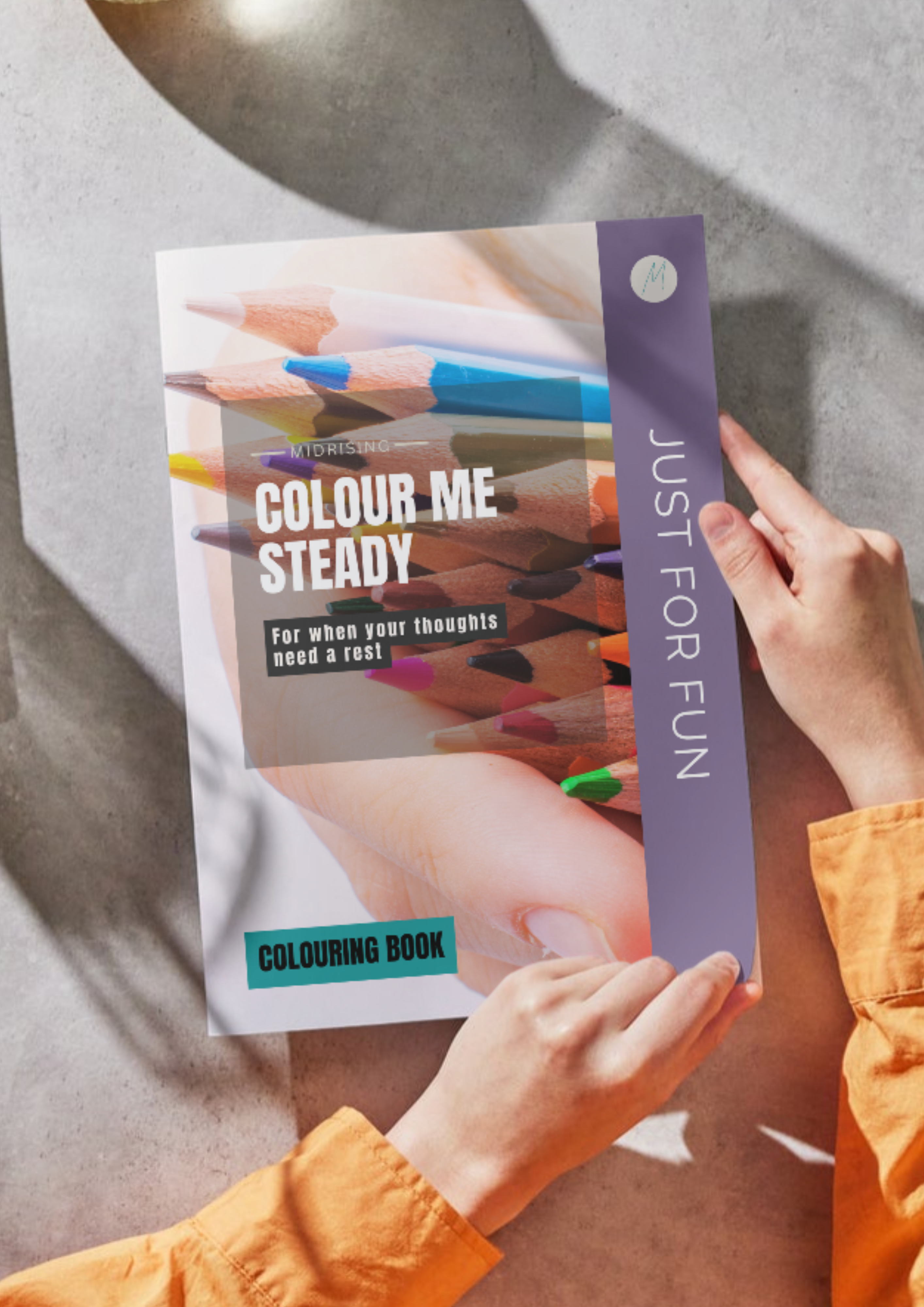 Woman holding the Colour Me Steady colouring book by Midrising