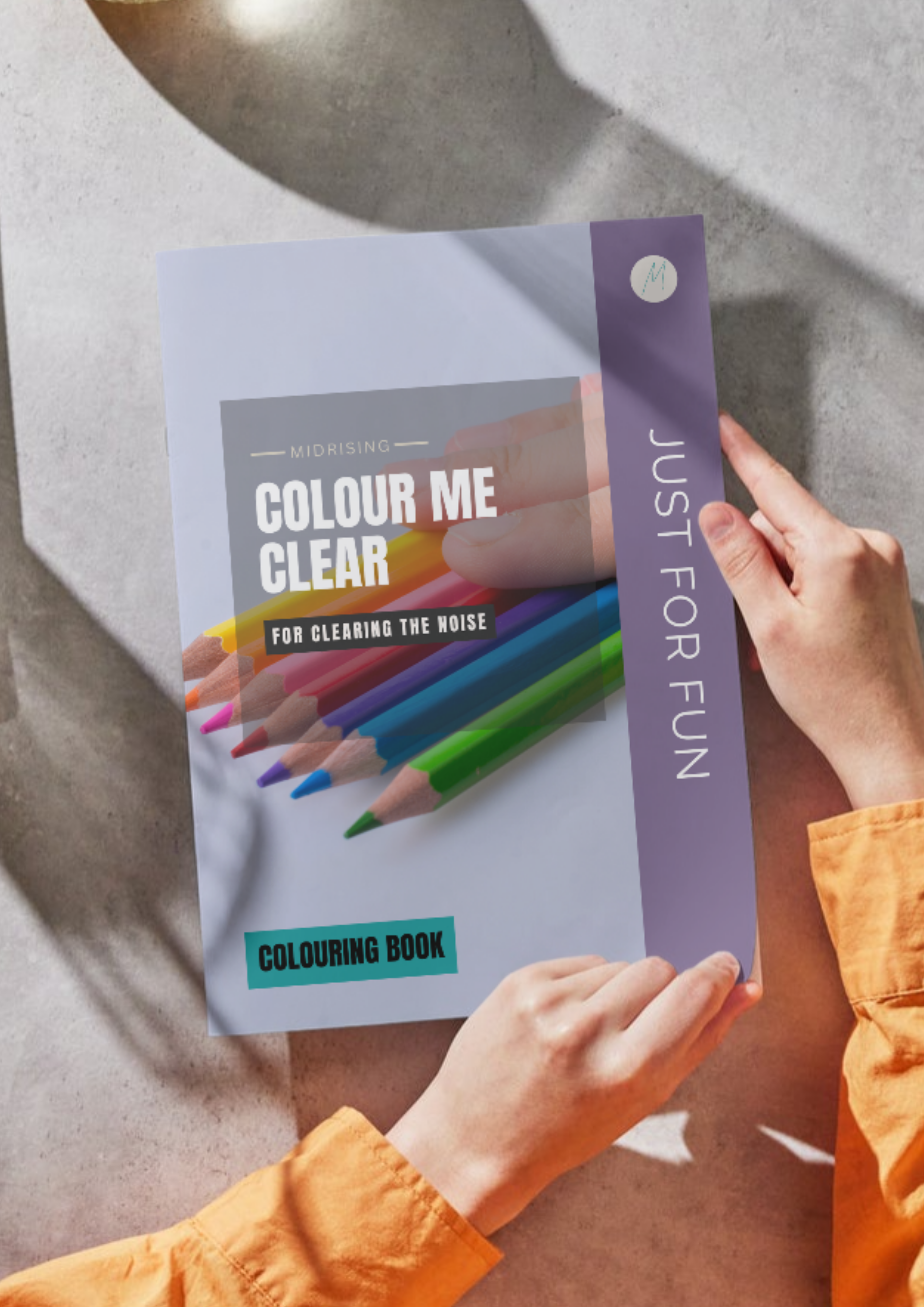 Woman holding the Colour Me Clear colouring book by Midrising
