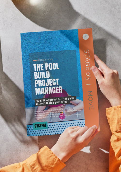 The Pool Build Project Manager PDF guide open on a desk, showing the companion guide layout and Midrising branding.