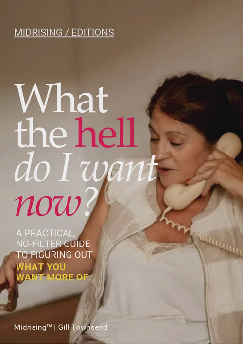 Midrising Editions cover for What the Hell Do I Want Now? featuring a midlife woman in a cream blouse holding a vintage telephone receiver. Warm beige background with bold white and hot-pink editorial typography. Subtitle reads: “A practical, no-filter guide to figuring out what you want more of.”